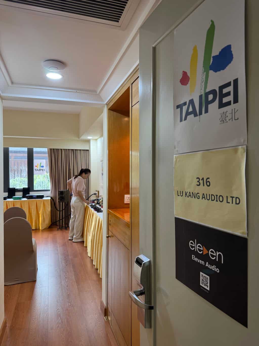 Conference room with audio equipment and Taipei signage.